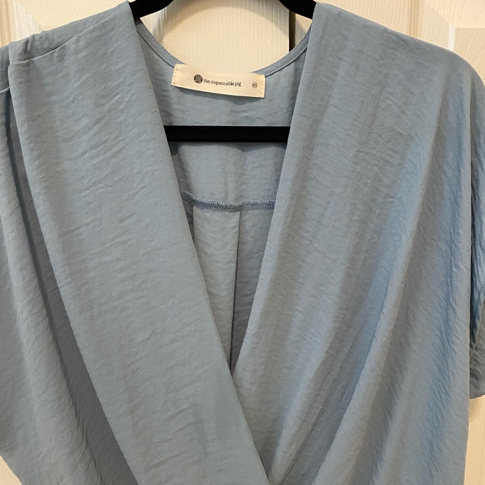 Light blue blouse with twist front